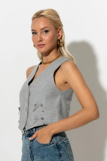 Cropped γιλέκο με λεπτομέρειες φιογκάκια γκρι