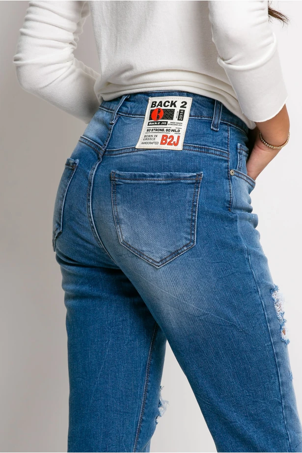 Jean loose fit με μεγάλες φθορές μπλε σκούρο Jean loose fit με μεγάλες φθορές μπλε σκούρο