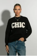 Πλεκτή μπλούζα με pach chic μαύρο Πλεκτή μπλούζα με pach chic μαύρο