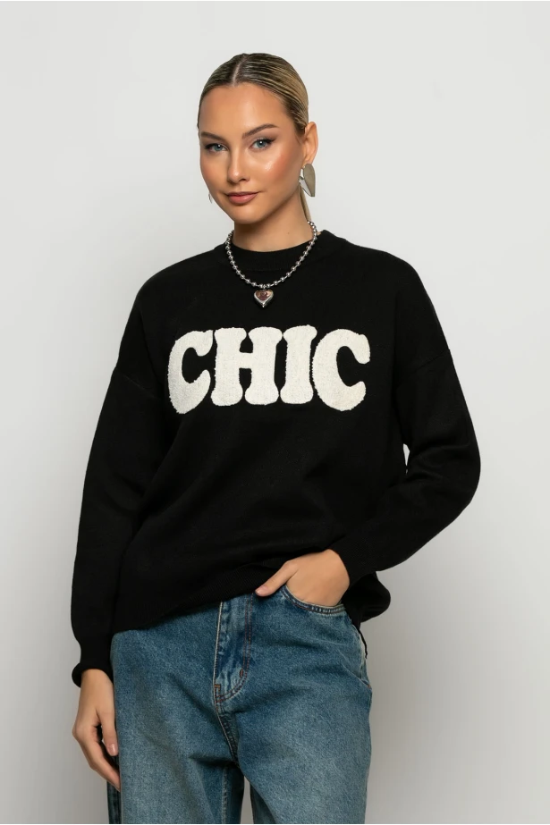 Πλεκτή μπλούζα με pach chic μαύρο Πλεκτή μπλούζα με pach chic μαύρο