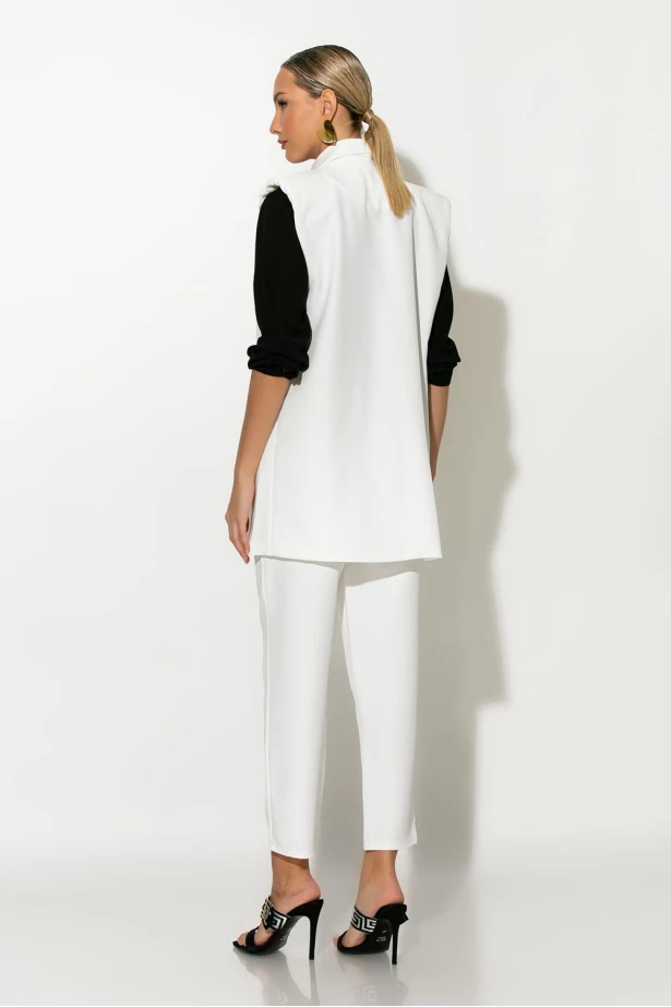 Σετ παντελόνι και oversized αμάνικο blazer με βάτες λευκό Σετ παντελόνι και oversized αμάνικο blazer με βάτες λευκό